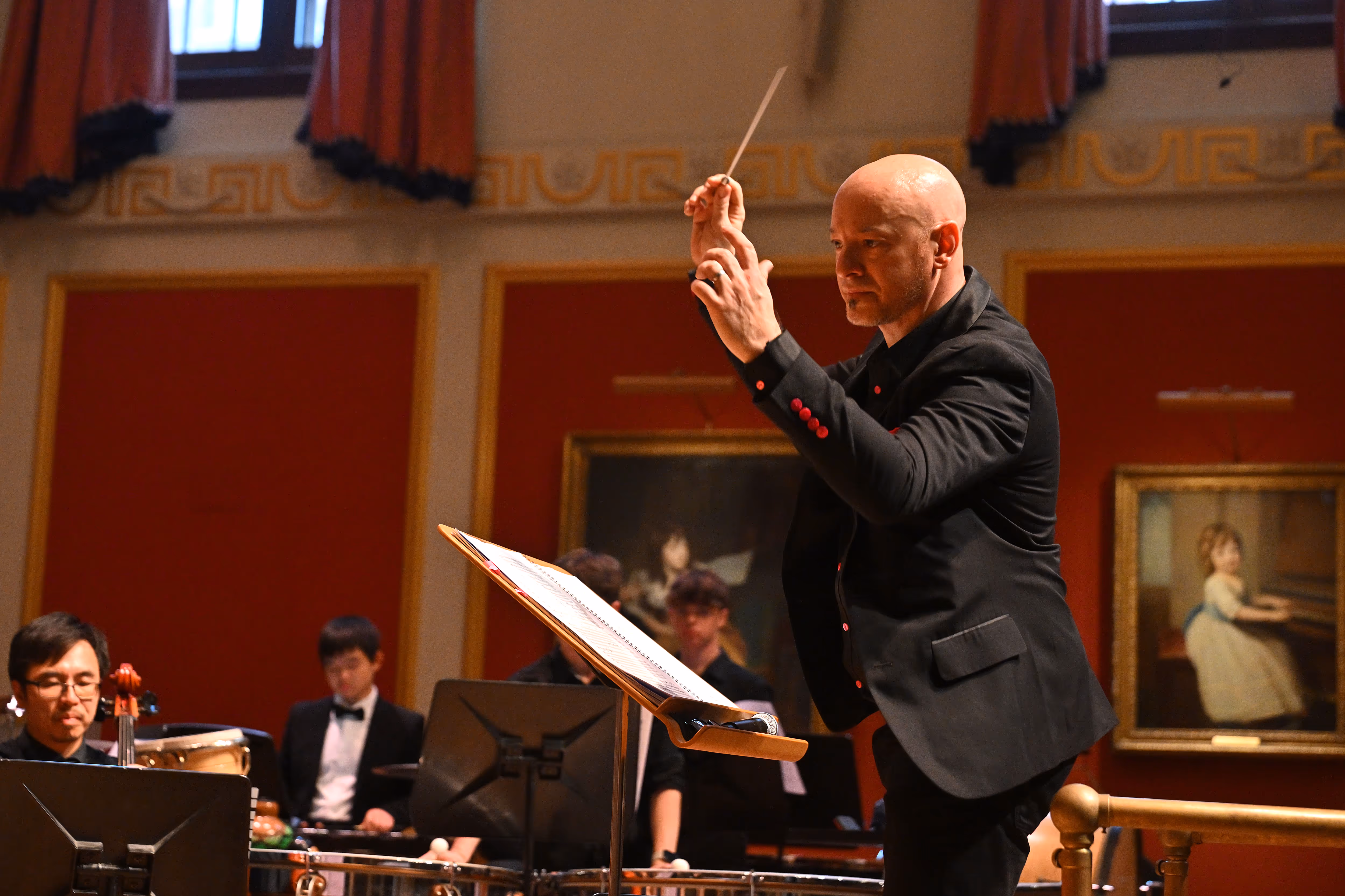 Russell Scott conducting an orchestra at the Royal Academy of Music
