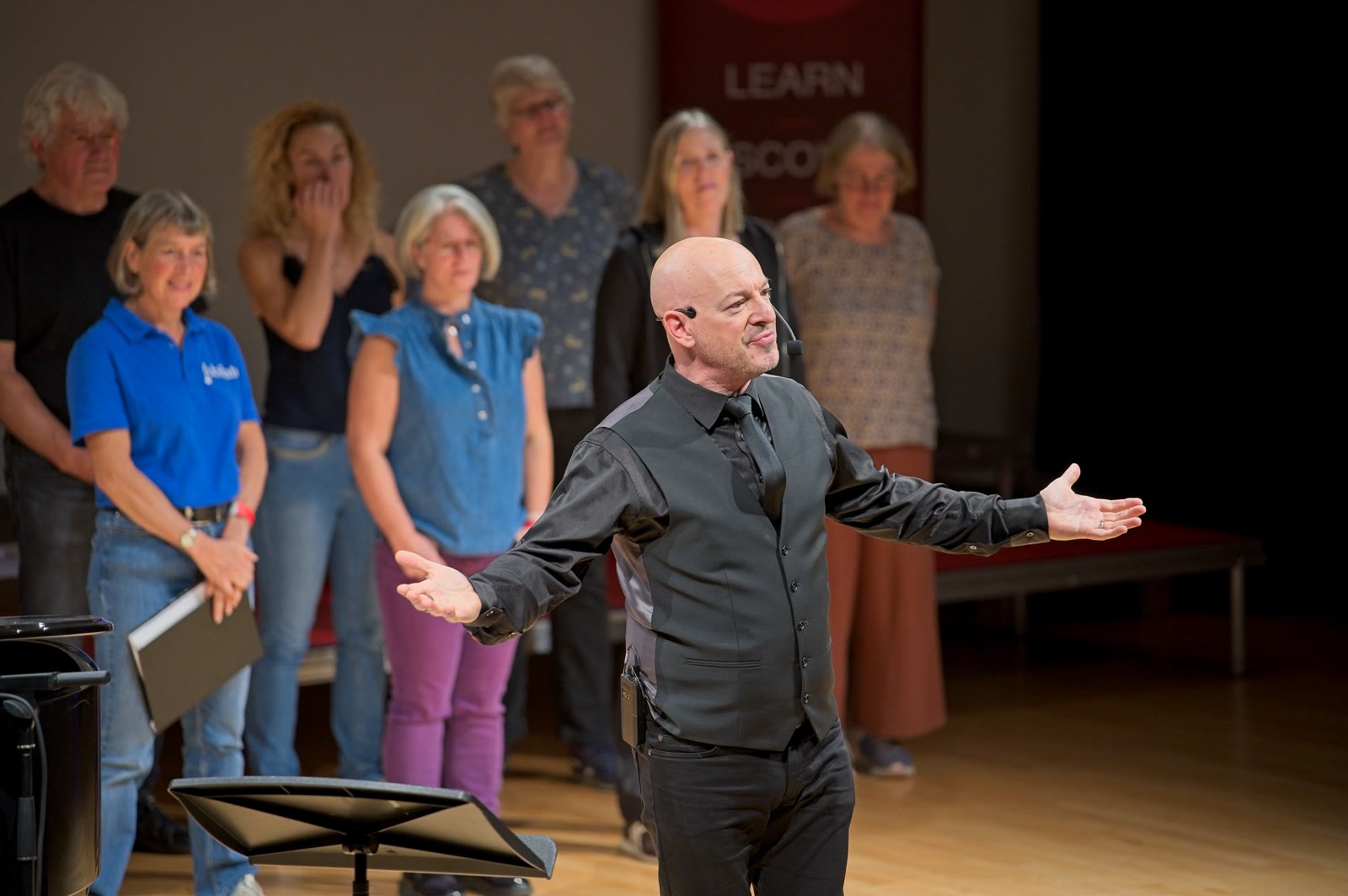 Russell Scott engaging with singers during a World Voices Festival workshop